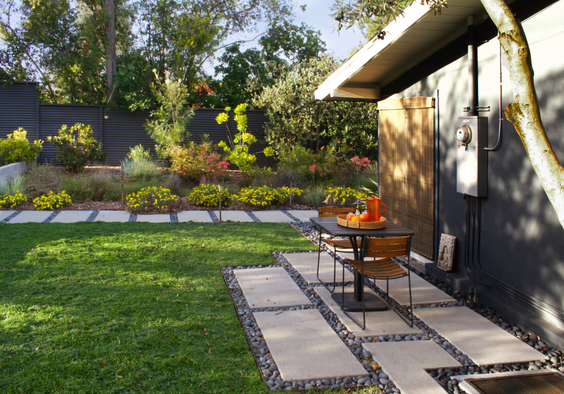 Custom concrete patio with stepping stones and outdoor seating area