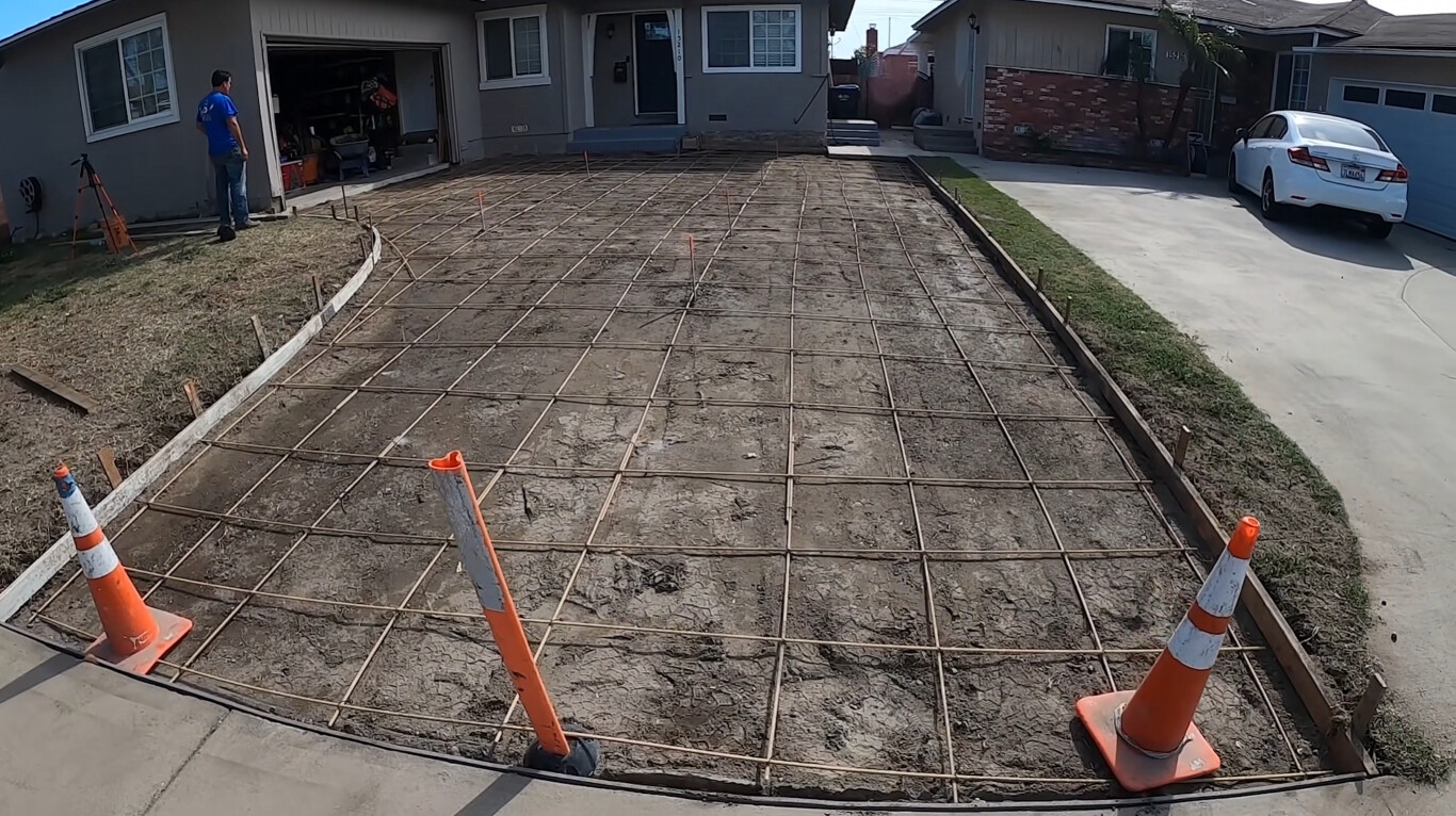 Concrete slab preparation with professional rebar grid installation